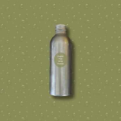 Silver bottle with reeds on a green textured background