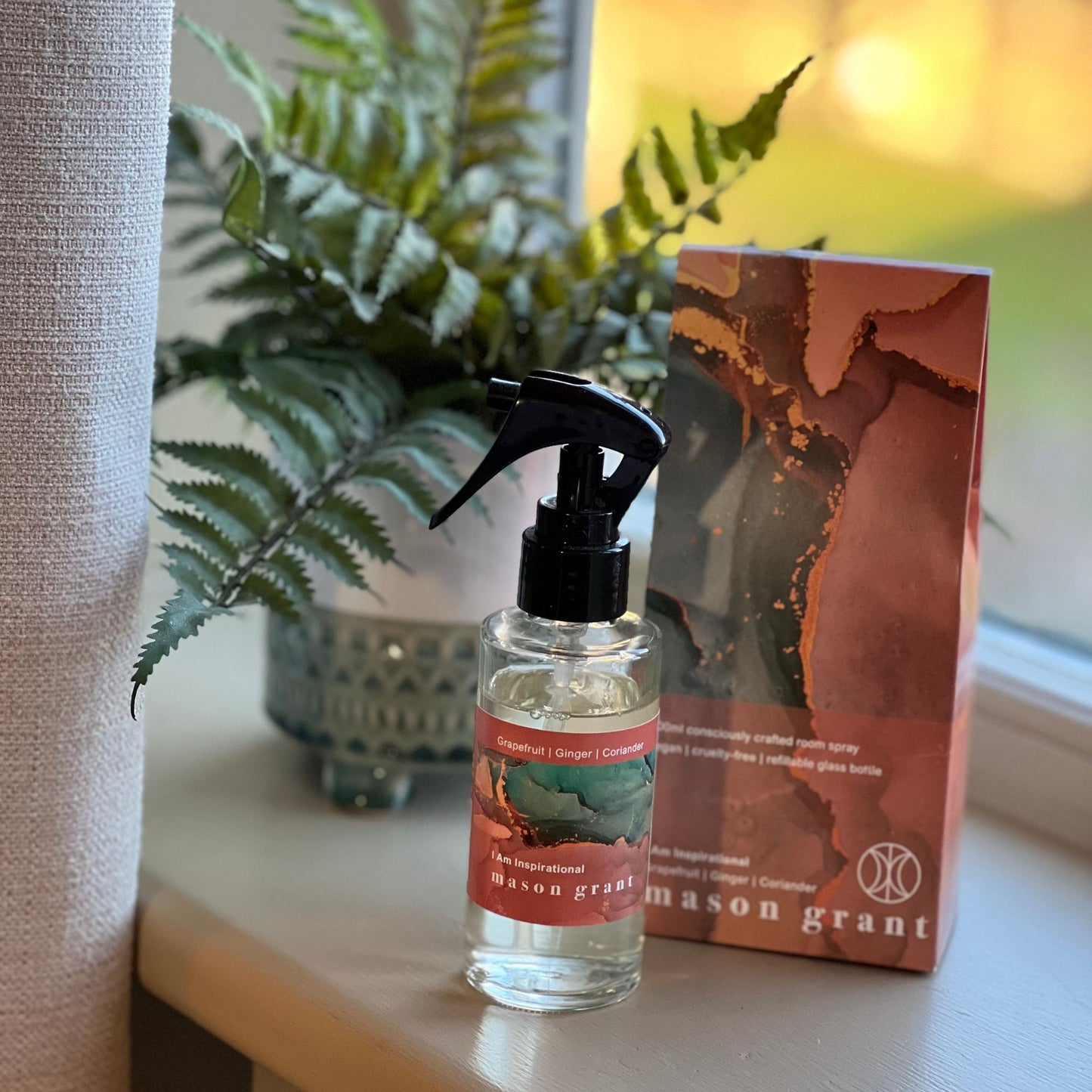 'Mason Grant' Grapefruit, Ginger and Coriander Room Spray bottle and box on windowsill with plant