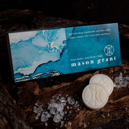 'Mason Grant' Grey Amber, Sea Spray and Sage Wax Melts on wood background