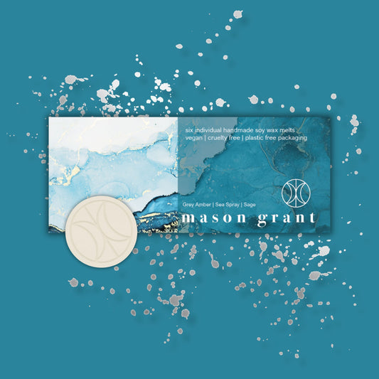 'Mason Grant' Grey Amber, Sea Spray and Sage Wax Melts on blue background