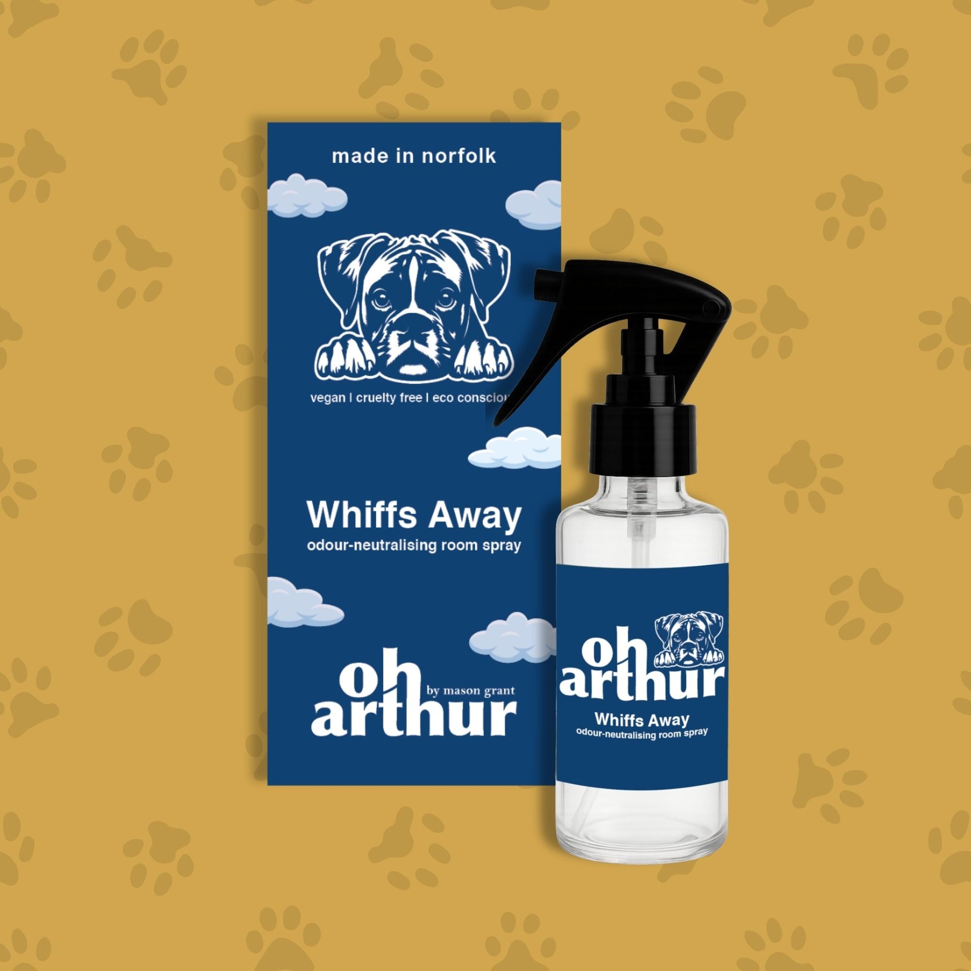 Oh Arthur Whiffs Away room spray bottle and packaging on a yellow background with paw prints.