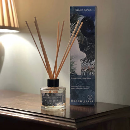 'Mason Grant' Orange, Clove and White Woods Reed Diffuser bottle and box on wooden table top
