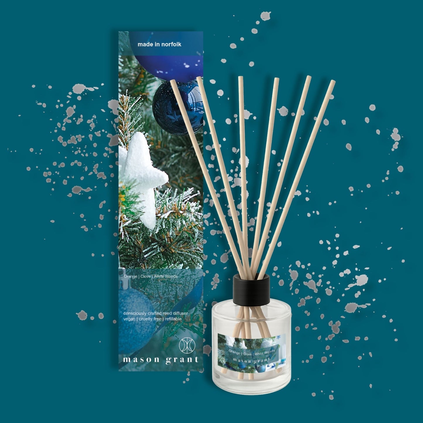 'Mason Grant' Orange, Clove and White Woods Reed Diffuser on blue background