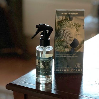'Mason Grant' Orange, Clove and White Woods Room Spray bottle and box on wooden table top