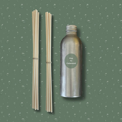 Silver bottle with reeds on a green textured background