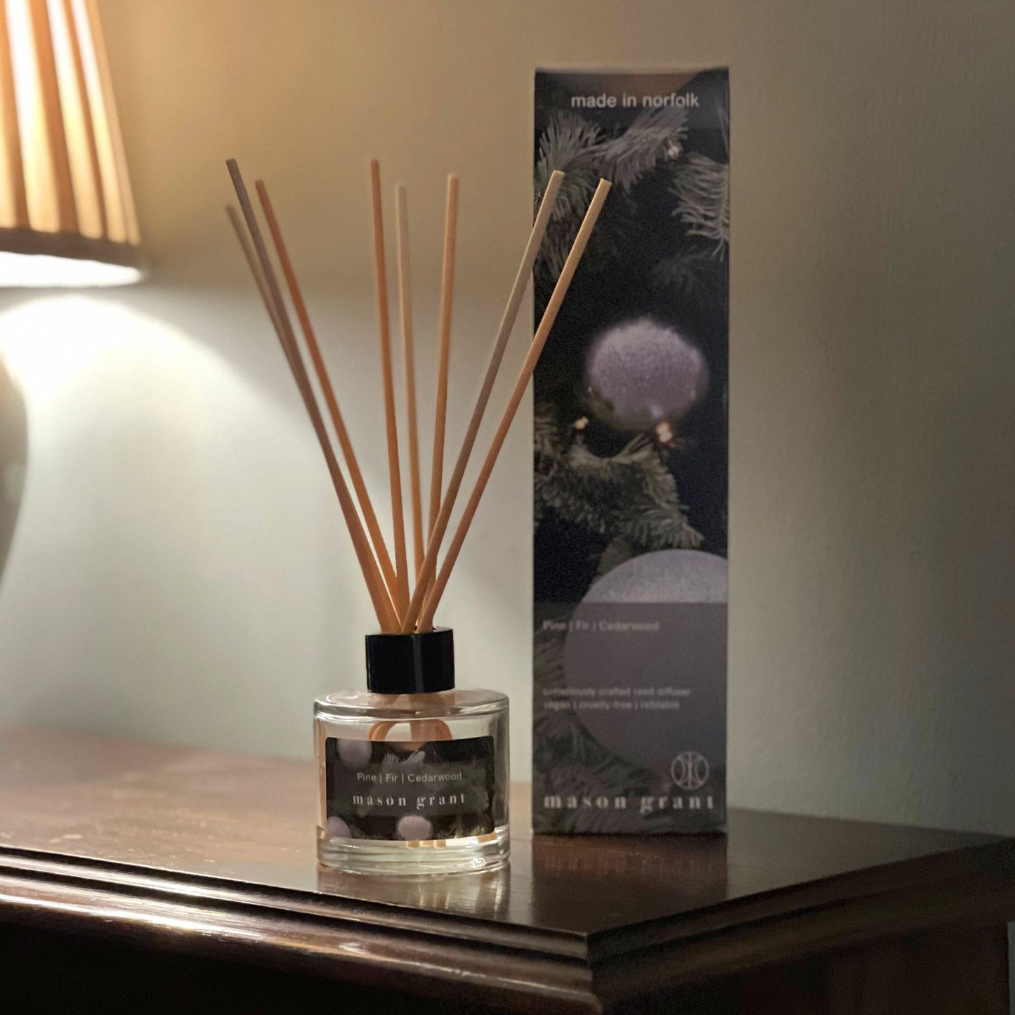 'Mason Grant' Pine, Fir and Cedarwood Reed Diffuser bottle and box on wooden table top
