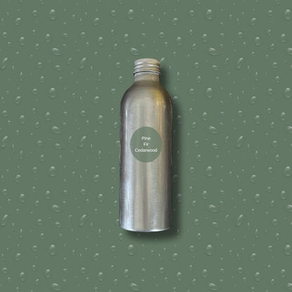 Silver bottle with reeds on a green textured background