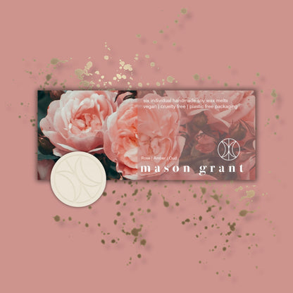'Mason Grant' Rose, Amber and Oud Wax Melts on pink background