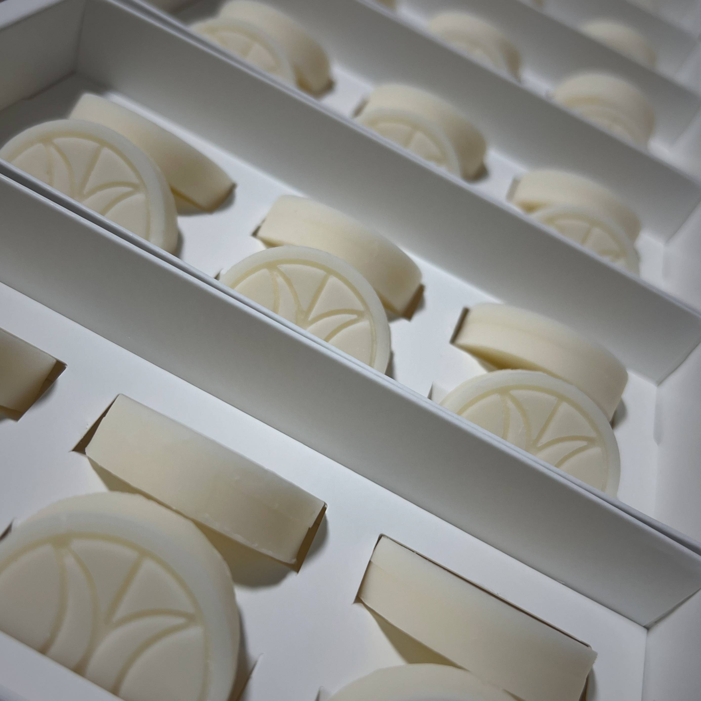 Close up of Mason Grant wax melts in white tray packaging